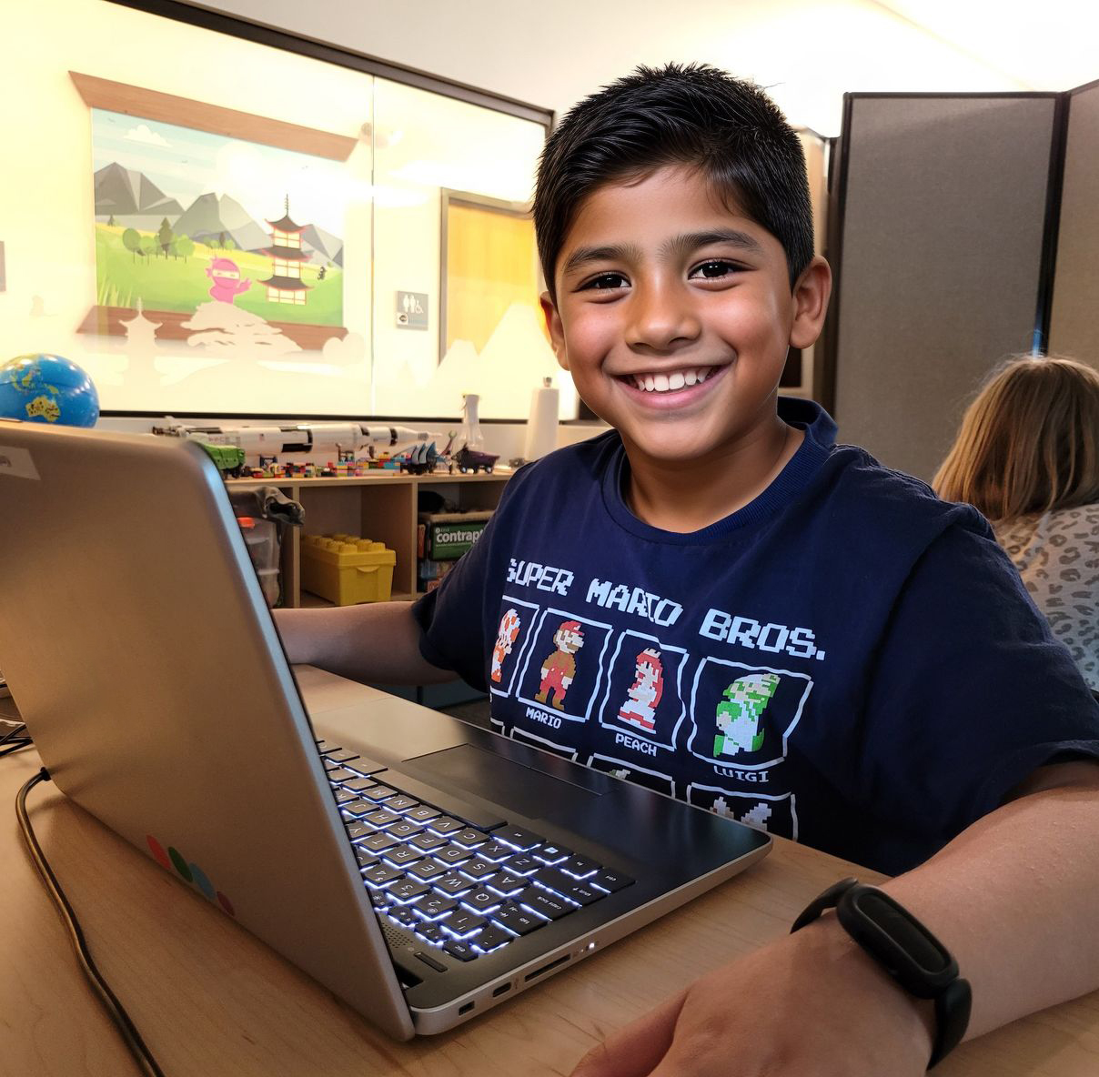 A young ninja building a game